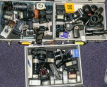 A collection of various 35mm cameras and equipment:, including lenses,