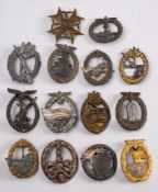 A group of German military badges:, including Tank Battle badge, Anti Partisan badge, U-Boat Badge,