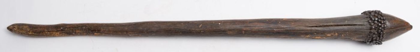 A wooden club possibly Zulu:, the head with a band of nailed decoration on a plain tapering shaft,