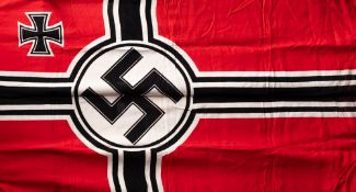 A Third Reich Kriegsmarine flag:, red cloth with printed back and white cross,