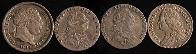 An 1817 George II shilling, two 1787 sixpences and a 1757 sixpence:.