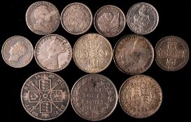 Twelve silver English coins.
