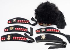 A Scottish Regimental feather bonnet with four tails and Gordon Highlanders cap badge:,
