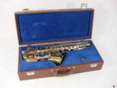 A B&M Champion saxophone in fitted case with accessories:.