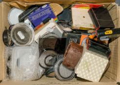 A collection of various 35mm filters and ring adapters:,