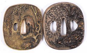 Two reproduction Japanese tsubas: both in the traditional style, one with cranes and foliage,