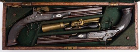 A cased pair of 19th century percussion target pistols by Patrick:,