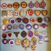 A collection of World War II lapel badges relating to canteens and comforts: including The Queens