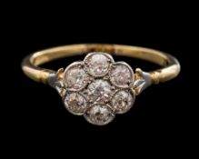 An early 20th Century diamond circular cluster ring: millegrain-set with round diamonds estimated