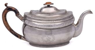 A George III Irish silver teapot, maker Robert Breading, Dublin, 1807: crested,