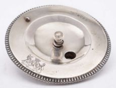 A George III Irish silver cover, maker possibly IB for James Brady, Dublin, 1817: crested,