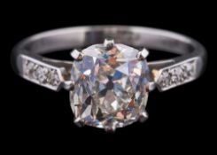 A diamond single-stone ring: the cushion-shaped old brilliant-cut diamond approximately 8.