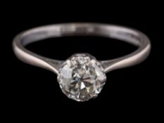 An 18ct white gold and diamond solitaire ring: the round old brilliant-cut diamond approximately 6.