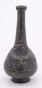 A Chinese bronze incense bottle in three sections: with slender neck and key fret rim,