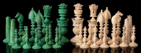 A 19th Century Indian Vizagapatam ivory chess set: one side stained green the other left natural,