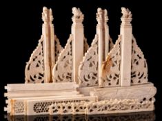 A pair of Chinese ivory table screens: carved with cranes and sea creatures, 15.5cm.