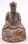 A Chinese carved wood figure of a Daoist deity: wearing flowing robes, seated in dhyanasana,