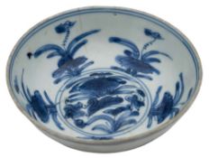 A Chinese blue and white porcelain small bowl: painted with a duck swimming amongst lotus flowers