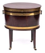 A George III mahogany and brass bound oval wine cooler: on stand,