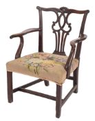 A George III elm elbow chair in the Chippendale taste:,