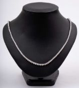 A graduated diamond line necklace: comprising 212 round,