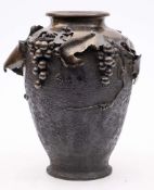 A large Japanese bronze vase: of ovoid form decorated with vine leaves and bunches of grapes,