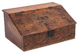 An early 18th Century carved oak bible box:, the sloping hinged fall with initials 'I.S.