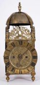 A brass lantern clock signed A.
