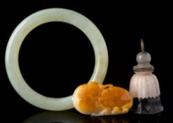 A mixed lot of Chinese jade: comprising a celadon and russet pendant in the form of two peaches,