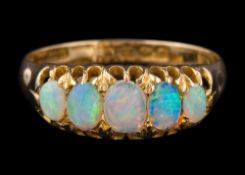 An 18ct gold and opal five-stone ring: set with graduated oval opals,
