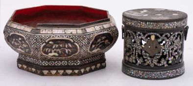 A Chinese lac-burgaute octagonal bowl and a box and cover: inlaid in mother of pearl with flowering