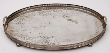 A silver plated serving tray: of rectangular outline with moulded border and loop carrying handles
