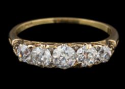A graduated diamond five-stone ring: with round old brilliant-cut diamonds estimated to weigh a
