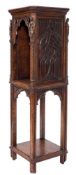 A Victorian Gothic carved oak square open pedestal cabinet:, the top with cut corners,