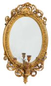 A 19th Century giltwood and gesso oval girandole mirror:,