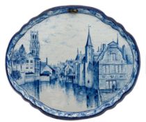 A pair of Tichelaar Makkum blue and white delftware topographical plaques: of cartouche form,