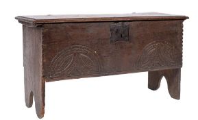 A late 17th Century oak plank coffer:, with a plain rectangular hinged moulded top,