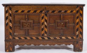 A late 17th/early 18th Century oak rectangular coffer:, with a hinged moulded top,