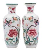 A pair of Chinese famille rose baluster vases: each painted with colourful birds perched on knarled