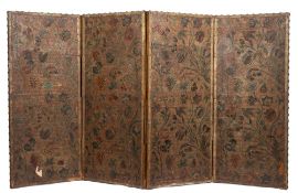 An embossed leather four-fold low screen in the William Morris taste:,
