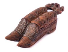 An 18th Century treen novelty snuff box: in the form of a pair of shoes,