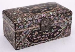 A Chinese lac-burgaute rectangular casket: with white metal mounts,