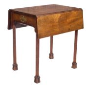 A George III mahogany Pembroke table:, with a rectangular hinged top,