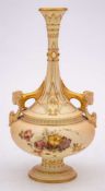 A Royal Worcester porcelain two-handled vase: with long slender neck and ram's head scroll handles,