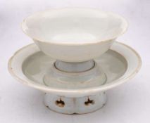 A Chinese Qingbai cup and stand: of petal form covered in a pale blue glaze, diameter of stand 14cm.