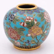 A Chinese cloisonne jarlet: decorated with peony sprays and an inscription on a turquoise ground