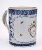 A Chinese export cylindrical mug inscribed with the initials 'J W': within a garlanded oval and
