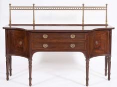 A late 19th Century mahogany, crossbanded and inlaid sideboard: of shaped outline,