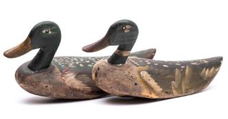 A pair of softwood and polychrome decorated decoy mallard ducks: each 56cm. long.