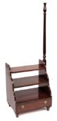 A set of mahogany three tread library steps:, in the Georgian taste,